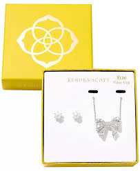 This Kendra Scott Krista Bow set features a crystal-adorned silver necklace and matching pearl stud earrings