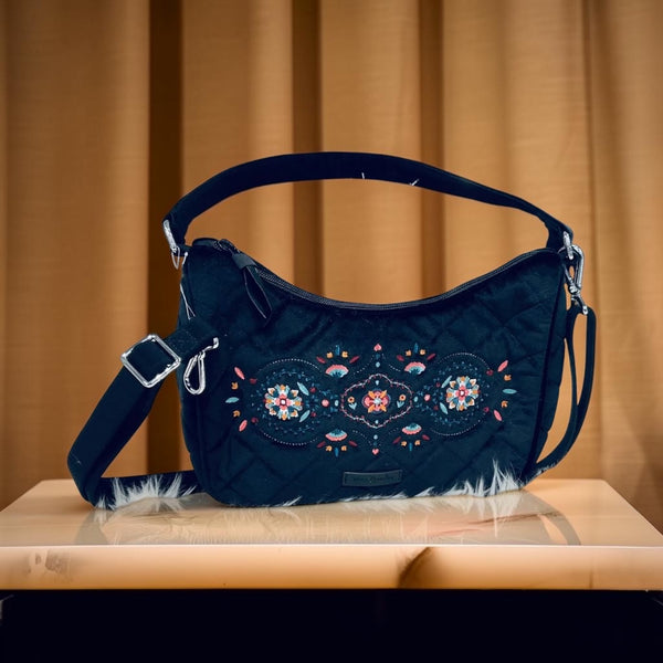 a Vera Bradley Velvet Frannie Crescent Crossbody Purse in the "Winter Ornaments"