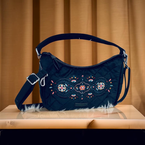 a Vera Bradley Velvet Frannie Crescent Crossbody Purse in the "Winter Ornaments"