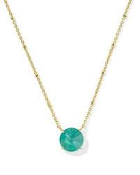 This Kendra Scott Jolie Short Pendant Necklace features a vibrant green stone set in gold