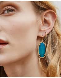 Kendra Scott Elle Gold Drop Earrings feature a teal tiger's stone